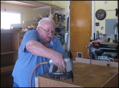 David Grayson building a bookcase