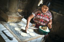 Elena demostrating the use of a fuel efficient cookstove in Guatemala