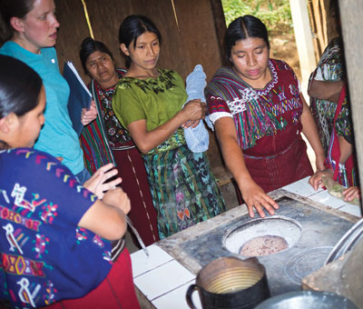 Elena demonstrating on fuel efficient cook stove