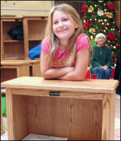 Girl and bookcase