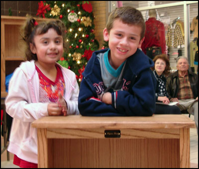 Girl, boy and bookcase